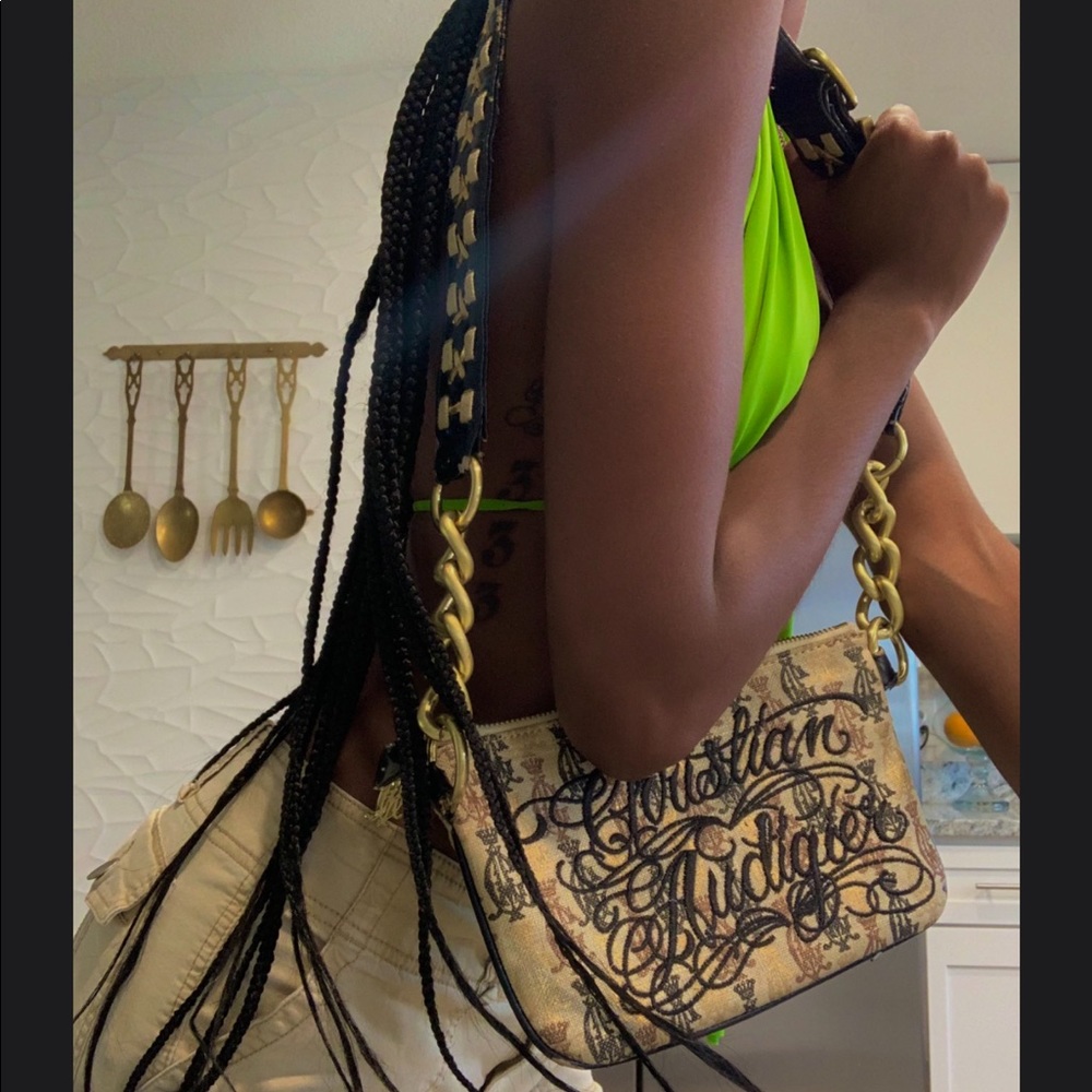 Anybody selling this Christian audigier bag? Hmu